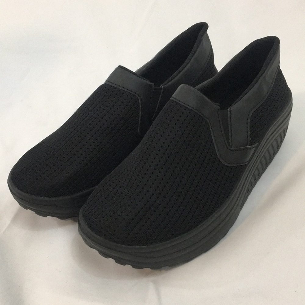 Solid black slip on sneaker, size 8